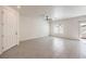 Bright living room featuring tiled floors, a window, and a glass door at 219 Cordelia Cove Ave # 513, Henderson, NV 89011