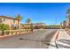Street view of gated community with desert landscaping and palm trees at 219 Cordelia Cove Ave # 513, Henderson, NV 89011