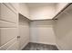Walk-in closet featuring shelving and carpeted floor at 219 Cordelia Cove Ave # 513, Henderson, NV 89011