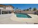 Private backyard featuring an inviting pool area, a covered patio, and desert landscaping for relaxation and enjoyment at 2341 Steinke Ln, Las Vegas, NV 89108