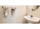 Charming half bathroom with a pedestal sink and decorative towels at 2341 Steinke Ln, Las Vegas, NV 89108