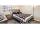 Cozy bedroom with a rustic wood headboard and a window that provides lots of natural light at 2341 Steinke Ln, Las Vegas, NV 89108
