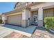 Inviting front entrance featuring stone pillars, desert landscaping and a glass storm door at 2341 Steinke Ln, Las Vegas, NV 89108