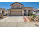 Charming two-story home featuring a two-car garage and low-maintenance desert landscaping at 2341 Steinke Ln, Las Vegas, NV 89108
