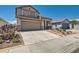 Charming two-story home with desert landscaping, attached garage, and separate garage in back at 2341 Steinke Ln, Las Vegas, NV 89108