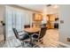 Eat-in kitchen area featuring wood cabinets, granite countertops and sliding glass door at 2341 Steinke Ln, Las Vegas, NV 89108
