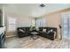 Comfortable living room with wood look tile floors, plantation shutters and modern decor at 2341 Steinke Ln, Las Vegas, NV 89108