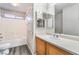 Bathroom featuring a single sink vanity, tub, and tile shower at 2407 Belt Buckley Dr, Henderson, NV 89002