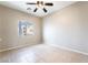 Bright, neutral bedroom filled with natural light from window and tile flooring at 2407 Belt Buckley Dr, Henderson, NV 89002