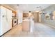 Bright kitchen featuring an island, white appliances, and tile flooring for easy cleanup at 2407 Belt Buckley Dr, Henderson, NV 89002