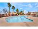 Community pool with palm trees and well-maintained pool deck perfect for relaxing outdoors at 2407 Belt Buckley Dr, Henderson, NV 89002