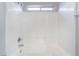 Bright shower featuring white tile walls, a shower head, and fixtures at 2407 Belt Buckley Dr, Henderson, NV 89002