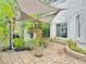 Charming backyard with decorative foliage, shade canopy, and stone-paved area for relaxation at 2451 Tour Edition Dr, Henderson, NV 89074