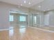 Empty bedroom with mirrored sliding closet doors, laminate floors, and neutral paint at 2451 Tour Edition Dr, Henderson, NV 89074