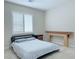 Bedroom with a neutral wall, carpet, modern headboard and window with blinds at 2451 Tour Edition Dr, Henderson, NV 89074