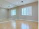 Empty bedroom featuring a wall of mirrors, neutral paint and carpet flooring at 2451 Tour Edition Dr, Henderson, NV 89074