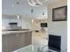 Modern kitchen showcasing a stone countertop bar and open access to the living room at 2451 Tour Edition Dr, Henderson, NV 89074