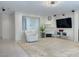 Comfortable living room featuring a chair, wall-mounted TV, and contemporary recessed lighting at 2451 Tour Edition Dr, Henderson, NV 89074
