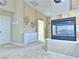 Spacious living room with a fireplace, neutral tones, and carpet flooring at 2451 Tour Edition Dr, Henderson, NV 89074