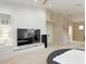 Bedroom with a modern style, ceiling fan and a large tv at 2451 Tour Edition Dr, Henderson, NV 89074