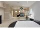 Spacious bedroom with a large bed, ceiling fan, fireplace, and closet space at 2451 Tour Edition Dr, Henderson, NV 89074
