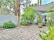 Paver patio with shade sail, landscaping, and water feature offer tranquil outdoor living at 2451 Tour Edition Dr, Henderson, NV 89074