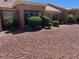 Home backyard with xeriscape design, rock landscaping and mature bushes at 2609 Sierra Sage St, Las Vegas, NV 89134