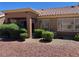 Home backyard with xeriscape design, rock landscaping and mature bushes on a sunny day at 2609 Sierra Sage St, Las Vegas, NV 89134