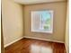 Bedroom with wood floors, beige walls and a large window with nice views and bright light at 2609 Sierra Sage St, Las Vegas, NV 89134