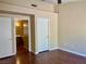 Primary bedroom includes hardwood floors and doorways leading to a bathroom and closet at 2609 Sierra Sage St, Las Vegas, NV 89134