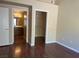 Primary bedroom includes hardwood floors and doorways leading to a bathroom and closet at 2609 Sierra Sage St, Las Vegas, NV 89134