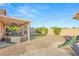Backyard featuring a covered patio, low maintenance yard, and hot tub at 2720 Mickey Mantle Ct, Las Vegas, NV 89108