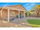 Cozy backyard with a covered patio, hot tub, and artificial grass area, perfect for entertaining and relaxation at 2720 Mickey Mantle Ct, Las Vegas, NV 89108