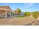 Spacious backyard with a low maintenance yard, covered patio, and hot tub at 2720 Mickey Mantle Ct, Las Vegas, NV 89108