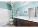 Tiled bathroom with shower over tub, dark vanity and colorful accents at 2720 Mickey Mantle Ct, Las Vegas, NV 89108