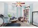 Cozy bedroom with blue striped walls, ceiling fan and treadmill at 2720 Mickey Mantle Ct, Las Vegas, NV 89108