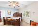 Comfortable bedroom with a decorative ceiling fan and a view of the neighborhood at 2720 Mickey Mantle Ct, Las Vegas, NV 89108