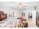 Well-lit bedroom with decorative accents, comfortable carpet and access to the dining area at 2720 Mickey Mantle Ct, Las Vegas, NV 89108