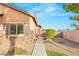 Beautiful home exterior with stone accents, a walkway, and drought-resistant landscaping at 2720 Mickey Mantle Ct, Las Vegas, NV 89108