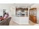 Modern kitchen featuring a breakfast bar with granite countertop and stainless steel appliances at 2720 Mickey Mantle Ct, Las Vegas, NV 89108