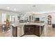 Open kitchen featuring stainless steel appliances, granite countertops, and views of the living area at 2720 Mickey Mantle Ct, Las Vegas, NV 89108