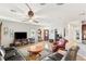 Cozy living room featuring hardwood floors, comfortable seating, and lots of natural light at 2720 Mickey Mantle Ct, Las Vegas, NV 89108