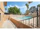 Backyard features an in-ground pool with fencing, palm trees, and a patio at 2809 Mason Ave, Las Vegas, NV 89102