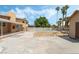 Large backyard features a sparkling pool, palms, spacious patio, and fire pit at 2809 Mason Ave, Las Vegas, NV 89102
