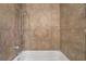 Shower with tile wall and white bathtub and chrome shower-head at 2809 Mason Ave, Las Vegas, NV 89102