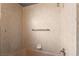 Retro bathroom with tiled walls, a shower head, and a towel rack at 2809 Mason Ave, Las Vegas, NV 89102