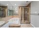 Modern bathroom featuring soaking tub and glass shower with granite vanity at 2809 Mason Ave, Las Vegas, NV 89102