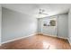 Bedroom with hardwood floors, a ceiling fan, and a sunlit window at 2809 Mason Ave, Las Vegas, NV 89102