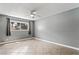 Bedroom with tile flooring, a ceiling fan, and a window with curtains at 2809 Mason Ave, Las Vegas, NV 89102