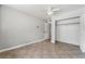 Bedroom with tile flooring, ceiling fan, and an open closet space at 2809 Mason Ave, Las Vegas, NV 89102